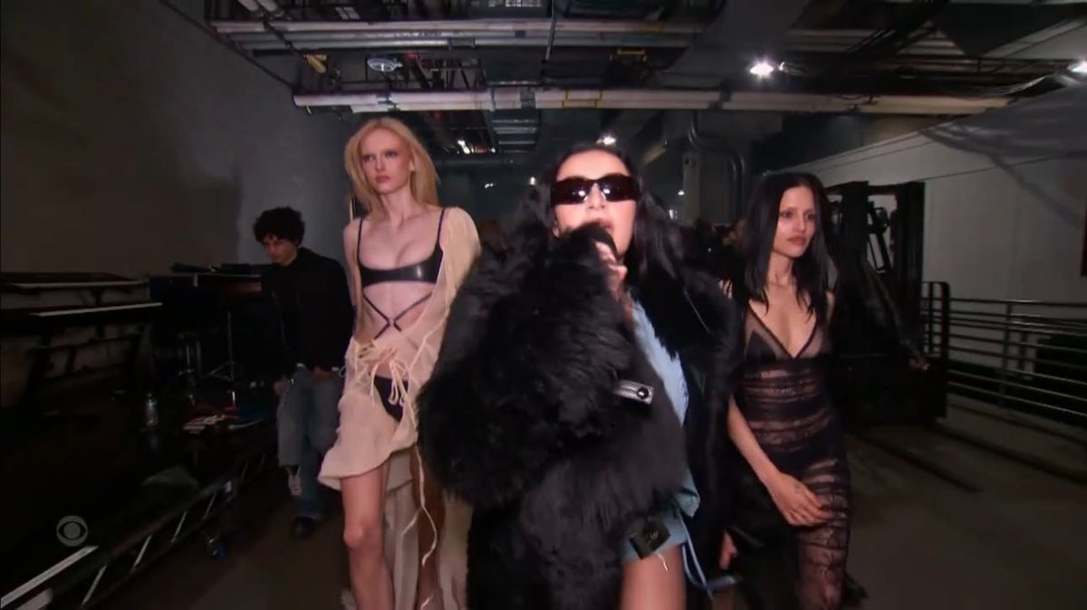 PopBase's tweet image. Charli XCX brings out Alex Consani for her #GRAMMYs performance.