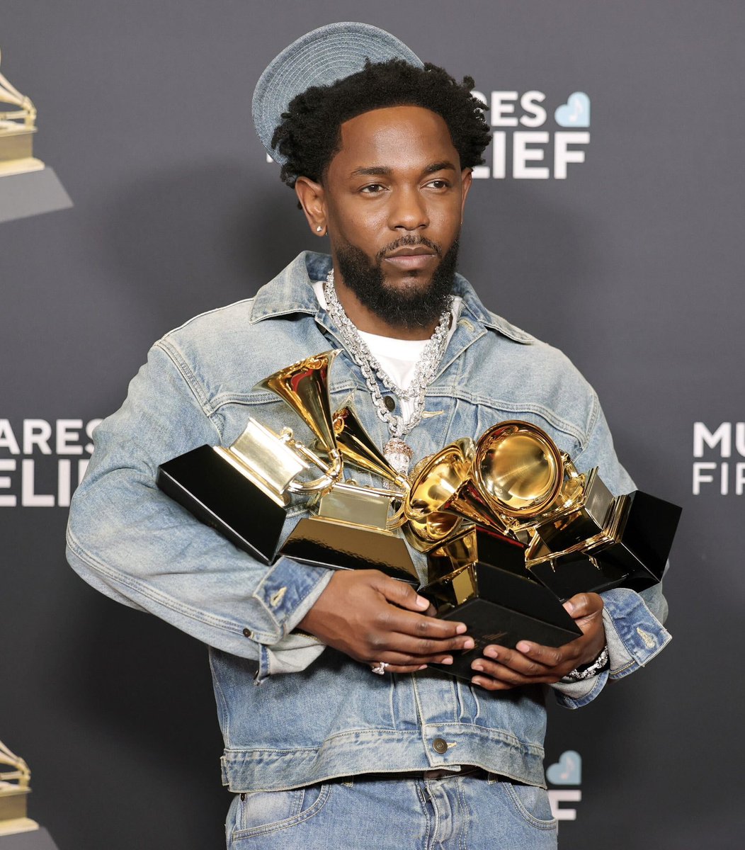 new Kendrick Lamar photo with all of his 5 Grammy award trophies #GRAMMYs