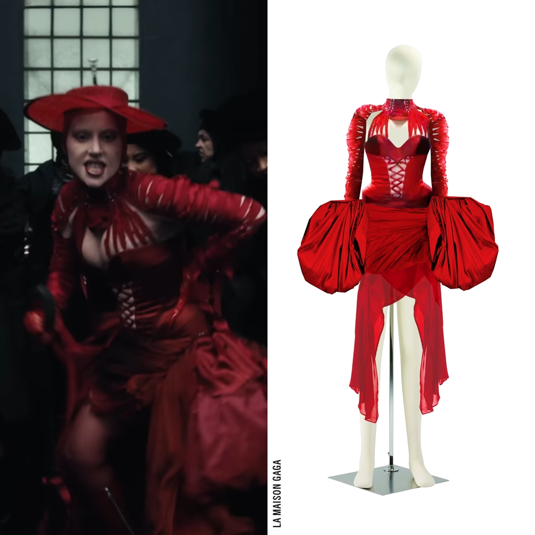 The other red look in the "Abracadabra" video shows Lady Gaga wearing a  custom #SamuelLewis x #SethPratt lace-up bodysuit with silk faille skirt  and lacing sleeves, @SJMillinery hat and @ChromeHeartsUSA "Sugar Jones"