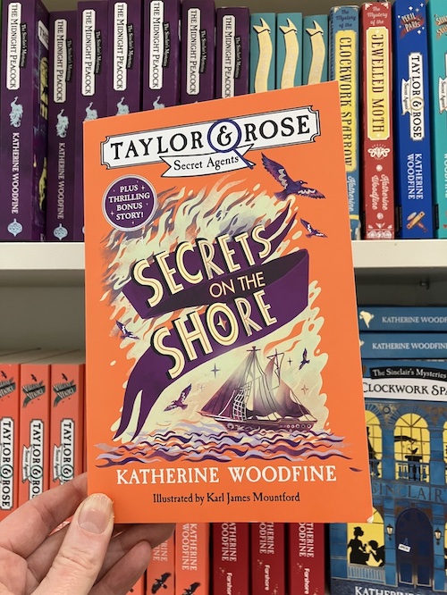 Katherine Woodfine (updates) (@followtheyellow) on Twitter photo Secrets on the Shore is out on 27th February! By popular demand the 'missing' Taylor & Rose adventure is coming in paperback - plus a bonus short story, case notes & more! 🧡💜
Order a signed and dedicated copy now from <a href="/ebbandflobooks/">ebb & flo bookshop</a>: ebbandflobookshop.co.uk/product/secret… Secrets on the Shore is out on 27th February! By popular demand the 'missing' Taylor & Rose adventure is coming in paperback - plus a bonus short story, case notes & more! 🧡💜
Order a signed and dedicated copy now from <a href="/ebbandflobooks/">ebb & flo bookshop</a>: ebbandflobookshop.co.uk/product/secret…