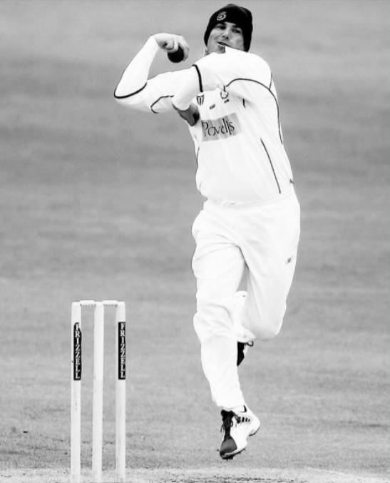 It was 20 years ago today ... Shane Warne bowls for Hampshire in a beanie in bitterly cold weather v Kent at Canterbury, May 14th 2005 (Tom Shaw)