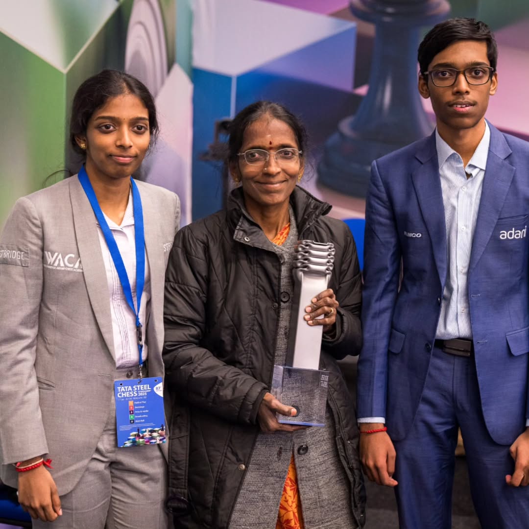 ChessBase India (@chessbaseindia) on Twitter photo Nagalakshmi is smiling ear to ear, holding a prized possession. It is her son Praggnanandhaa's biggest tournament win so far - the beautiful trophy of Tata Steel Chess Masters 2025! 
What a wonderful moment for the strongest chess family in India. The two GM siblings with their Nagalakshmi is smiling ear to ear, holding a prized possession. It is her son Praggnanandhaa's biggest tournament win so far - the beautiful trophy of Tata Steel Chess Masters 2025! 
What a wonderful moment for the strongest chess family in India. The two GM siblings with their