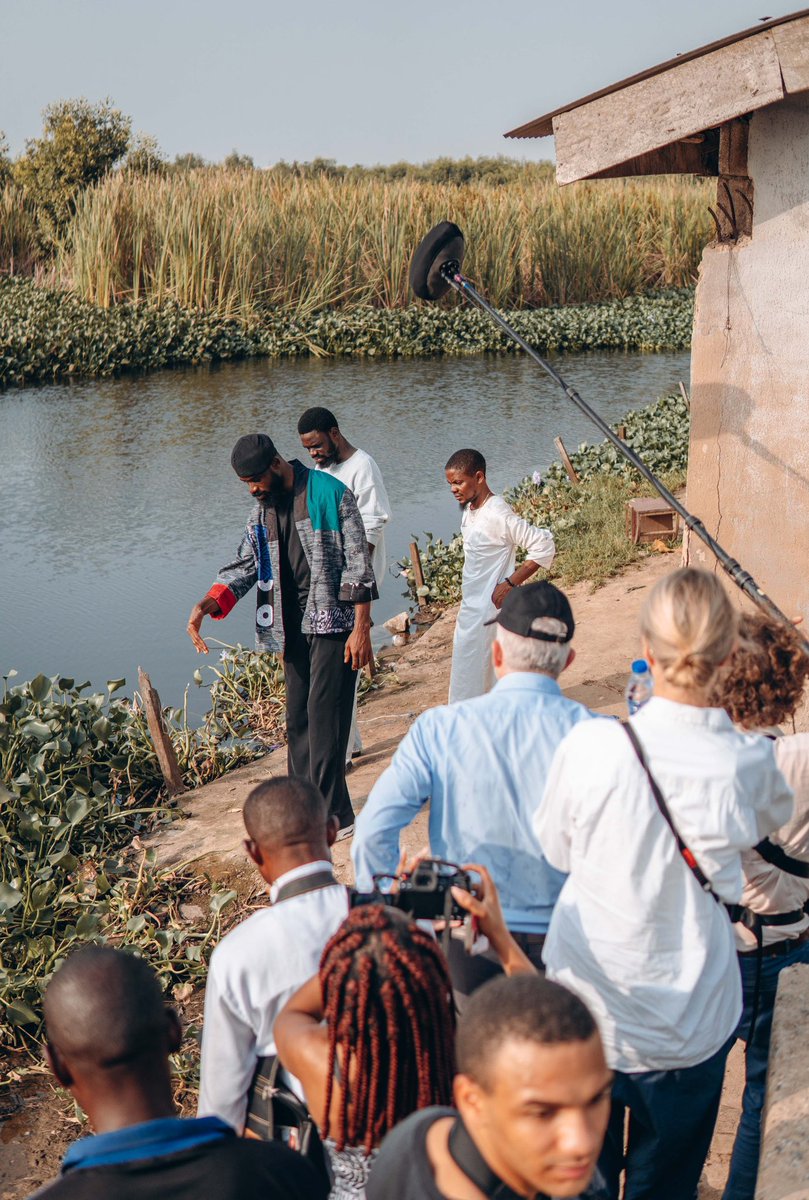 Tunde_OD's tweet photo. To the dreamers who left home…

I recently returned to the place in Ikorodu where I lived the first 20 years of my life. For the longest time, I hesitated to go back, unsure if I was ready to confront the flood of nostalgia and the weight of the memories I had suppressed. But after two years of filming a documentary about my journey, it was finally time to revisit the starting point of it all.

As we drove down the same streets I once raced through barefoot as a child, it felt like everything had shrunk to a miniature scale. The rustic roofs, the muddy streams, the dump sites, the old friends, the first girl I ever loved, the barber’s shop where I saw a chess board for the very first time, the church where I learned to play the piano—remained unchanged, as if time had stood still and became a museum of who I’d been.

Standing by the river where we once bathed as kids, I remembered the night I left. It was a cold evening in 2015: unable to renew the rent, my Dad had to return to the village to work in a bakery, my Mum took a job as a cleaner. I had no place to call home anymore. With my bags clutched tightly and tears welling in my eyes, I left behind the only life I had ever known. Terrified of the uncertainty ahead but with the will to fight for my place in the world.  I carried a piece of home with me with unwavering faith in my ideas.

It’s been 10 long years. Now, I have returned—not the same, but better—ready to leave a piece of my heart with the children here who, like me, are still dreaming .

It is the only way I can honor the privilege of who I have become.

To every dreamer who left home in pursuit of wonder, I know the hurt of those cold lonely nights and the loss of everything that was familiar . But I hope you never look back with regret. You must let your courage be your compass as you re-write your own story of becoming . You are growing into someone capable of holding the best of your past alongside the boundless potential that is in front of you. This is especially important if where you’re coming from is worlds apart from where you’re going. 
Your fight is a different one.

Home is not lost, it is growing alongside your story—because sometimes, the place where you’re born isn’t where you belong; you belong where you believe you belong….where is that place for you?

And when your battles are finally won, I hope you can look back on your journey with awe and gratitude. 
And like my mother would always tell me 
“Babatunde mi, ranti Omo eni tiwo nse”(wherever the wind takes you, you must remember the child of whom you are)

For the ones who left home to find themselves, must someday return to give themselves away.

Keep going dreamer. I hope you never stop giving the world something new to believe in.
