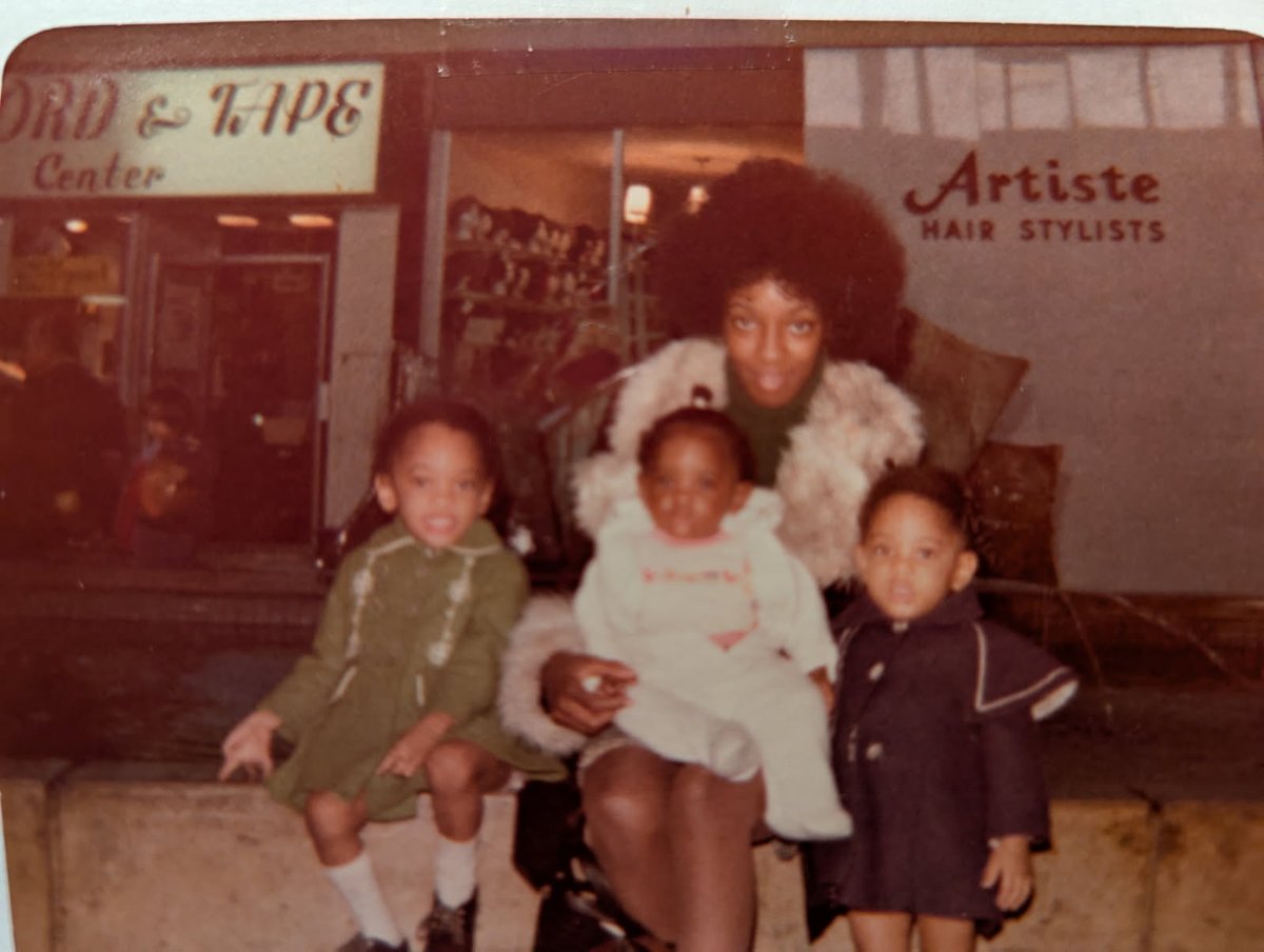 My mom, me, and two of my sisters. I'm in the blue coat.