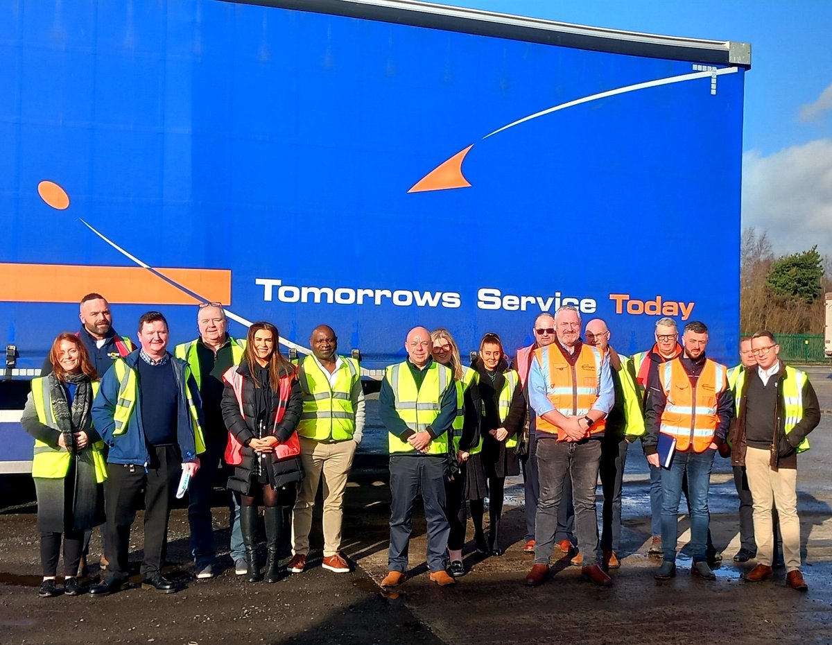 Group photo of Council members after a tour of TST's new warehousing facility following the council meeting.