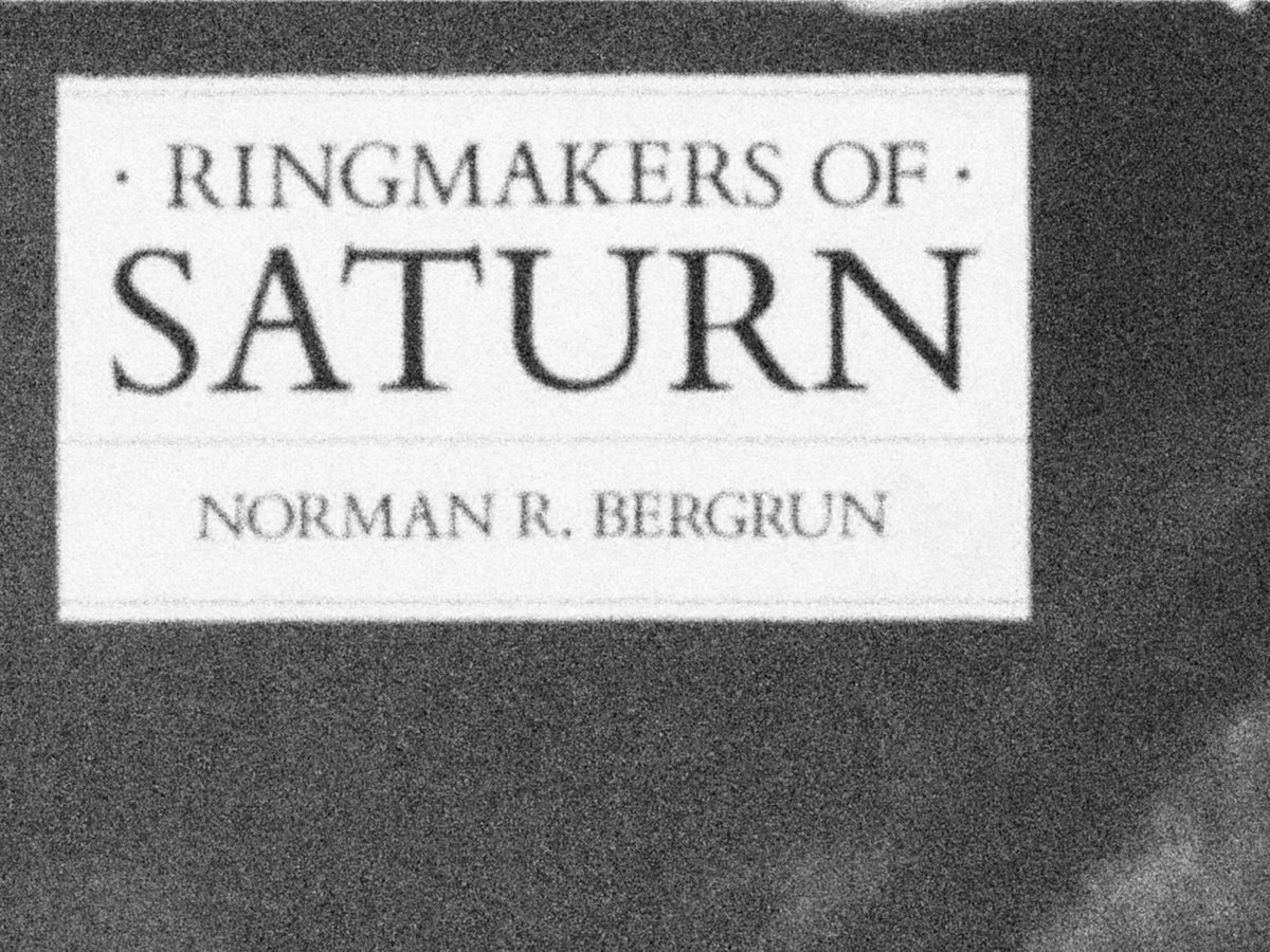 ulricheder's tweet photo. A few years ago I found a tattered copy of Norman Bergrun's 1986 book "Ringmakers of Saturn" at a flea market in Bangkok. Dr. Bergrun has been a #NASA engineer, and, as I still remember, he claims in the book that giant cylindrical spaceships of extraterrestrial origin are present near Saturn's rings and may be even involved in their formation and maintenance. The book includes images taken by NASA's #Voyager spacecraft, but in my highly worn copy these pages were unfortunately torn out. 

I googled the subject in that old era of inaccessible artificial intelligence, and learned that this concept was pretty much the opposite of the mainstream theory that the rings are remnants of a moon of Saturn destroyed by its tidal forces. As a result, the Bergrun thesis seemed to be ridiculed and rightly forgotten, and for many years, I no longer possess the book. However, the recent footage posted a few days ago by an anonymous astronomer of one or more Earth-sized #UFOs in #Saturn's rings may revive, validate, and confirm this obscure theory. #Ringmakers #BoredReader #UFOTwitter