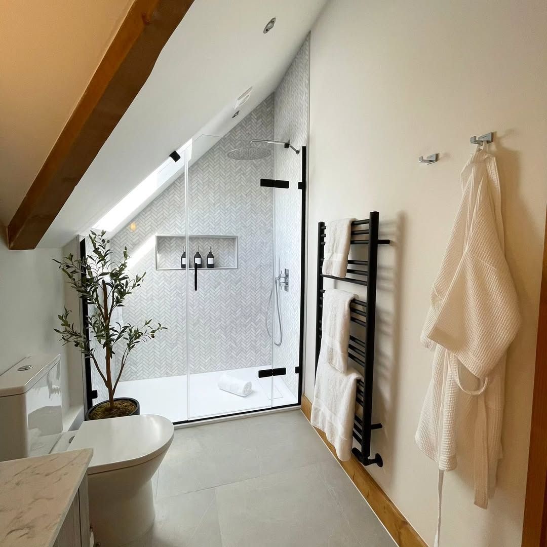 FIVE DAYS OF BATHROOM TRENDS FOR 2025🚿 

DAY TWO

SPACE-SAVING SOLUTIONS🏠 

Utilise awkward bathroom spaces to your advantage by working with them. We're so obsessed with this design by @aquanautplumbing (IG). The slanted roof and natural light add character to the space.