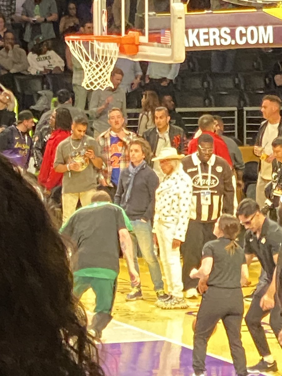 Anyone know who the Urban cowboy is in the white?  Lakers vs Celtics