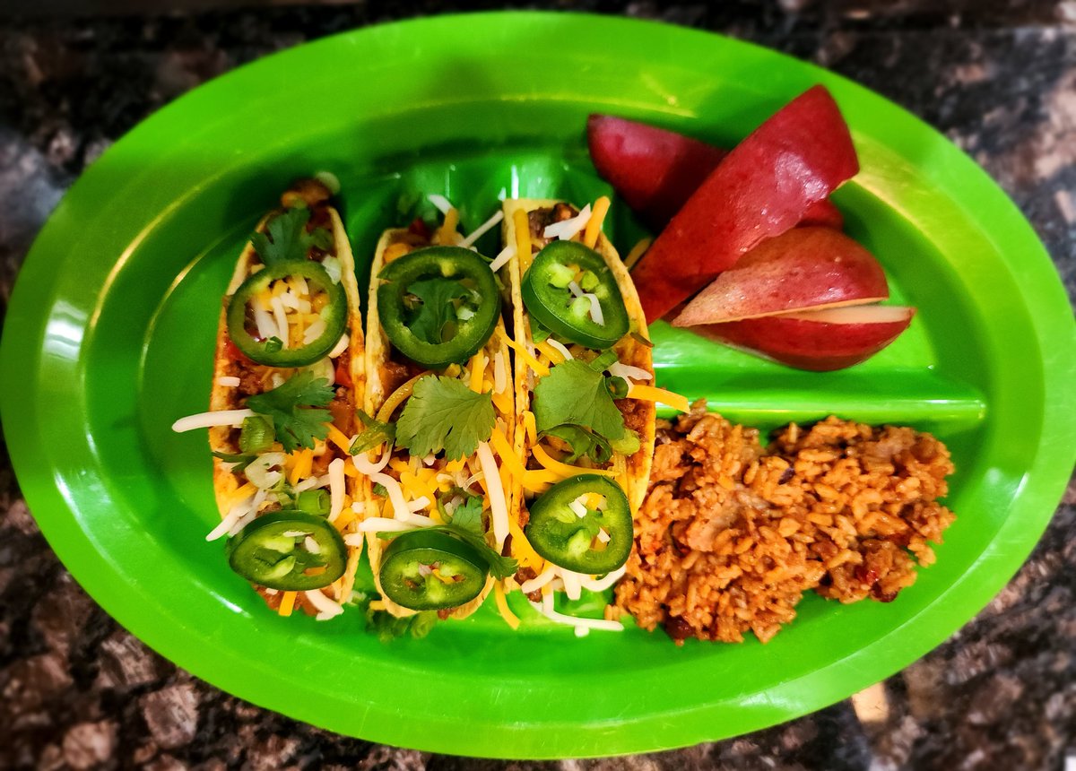 Tacos last night! 
Ground beef, taco spices, peppers (red, yellow, green), onions, corn, jalapeños, cilantro, sour cream,  and Mexican 4 cheeses. Side of Mexican rice and red pears.