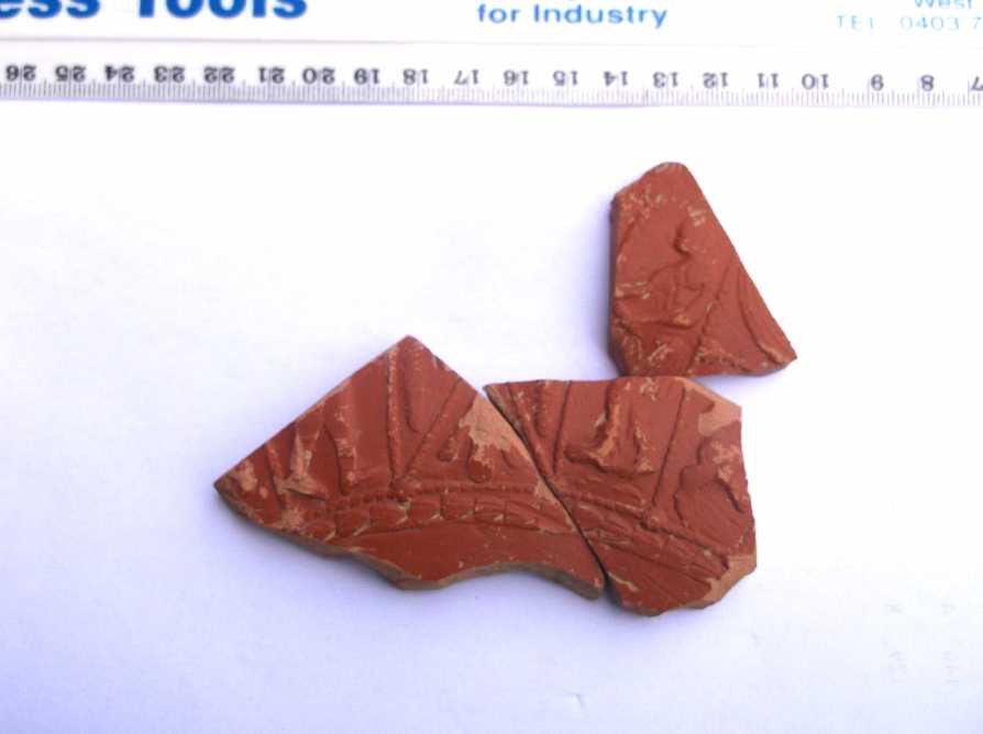 #FindsFriday 
These 3 fragments of a decorated Samian bowl were found this summer and fitted together after washing. Samian (or Terra Sigillata) was the most commonly used high quality pottery from Roman Britain. Can anyone here tell us anything more about the decoration?