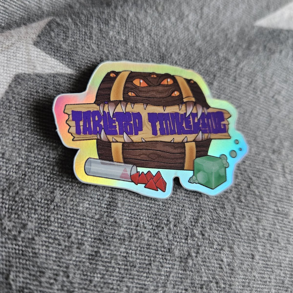 We put one of these lovely stickers in with online orders, and sometimes at cons! If you've ever received one we'd love to see what you've put it on. There's been over 300 given out over the past few years so there must be at least one or two on stuff. Send your pics to us!