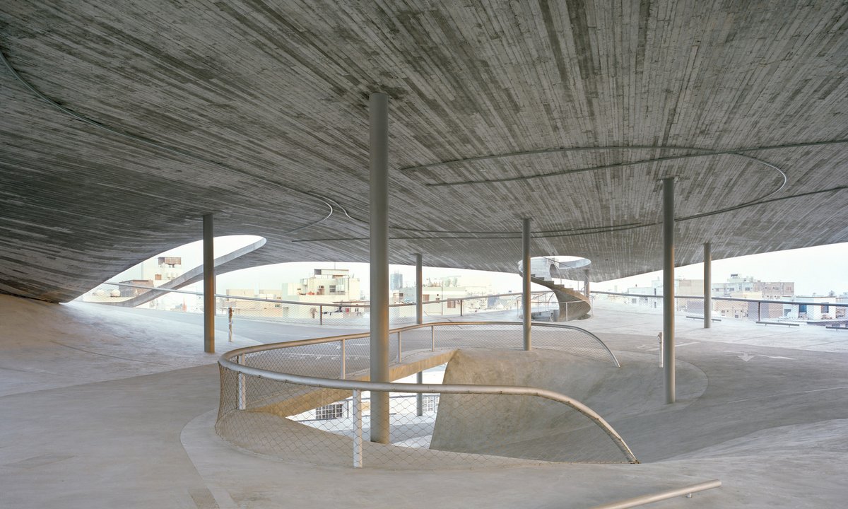 ArchDaily's tweet photo. The "Four Car Parks" project in #Muharraq's Old City Center, integrates sculptural, sloping slabs and exposed structural elements to create a dynamic, multifunctional public space. https://t.co/nW3E4YmMaB https://t.co/IViUMovn4r
