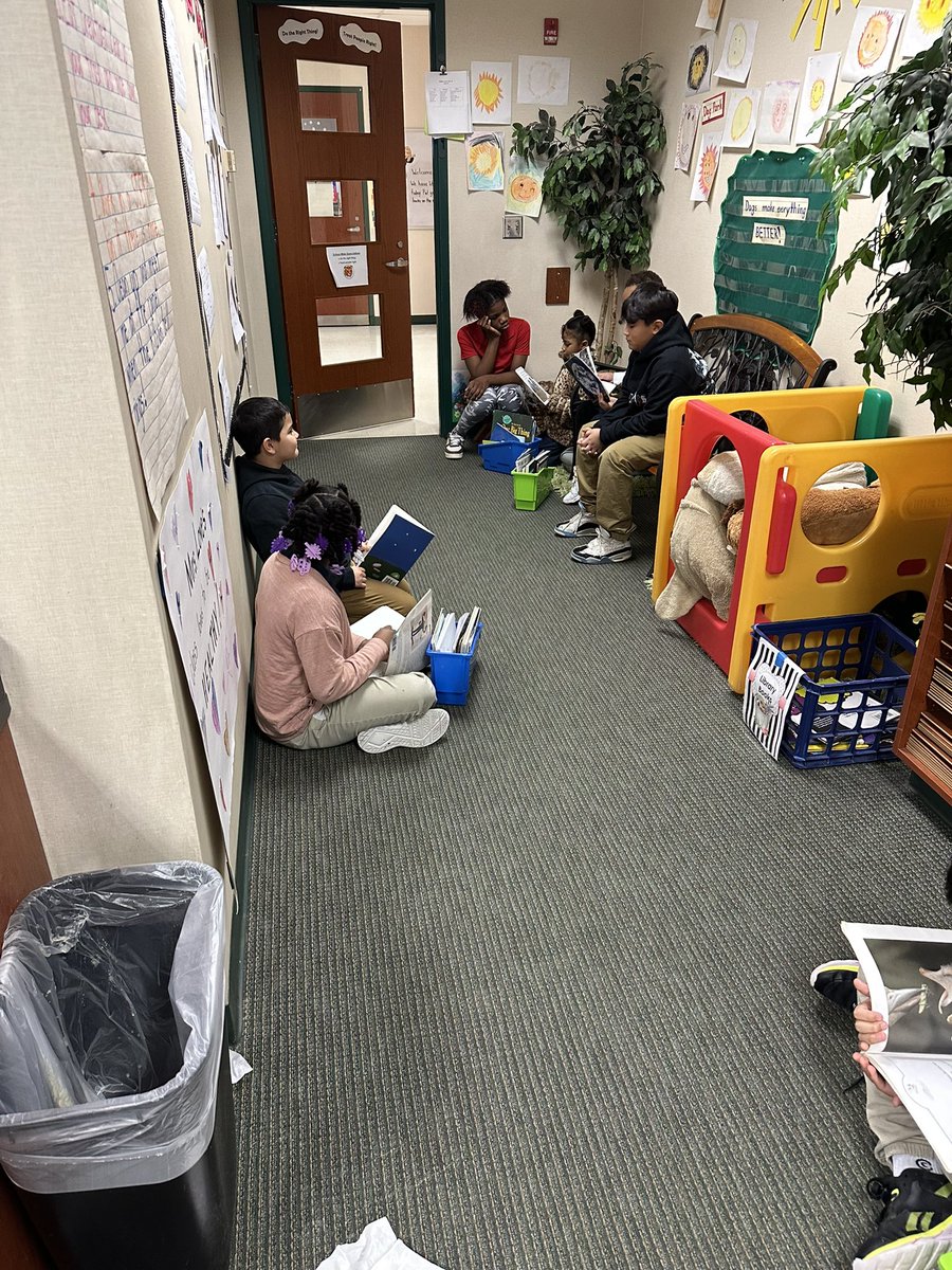 The students in 4th and 2nd grade are having a great time reading with their book buddies!