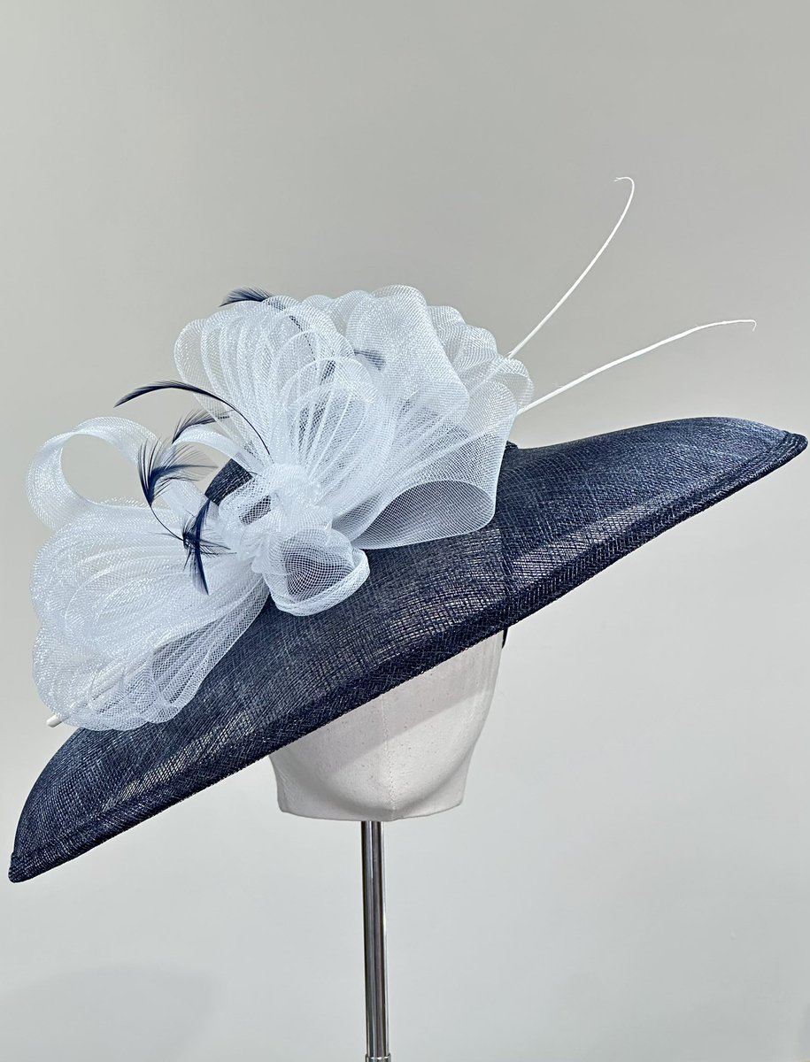Hat of the week
A stunning large down turned brimmed navy hat trimmed in white pleated crin &amp; quills 
Classic colour combination
Available to hire or purchase 
Open Tue-Sat 10-4
#hatoftheweek #hat #hathire #hirehat #hatshop #hathireshop ##wallingforduk #louiseclairemillinery