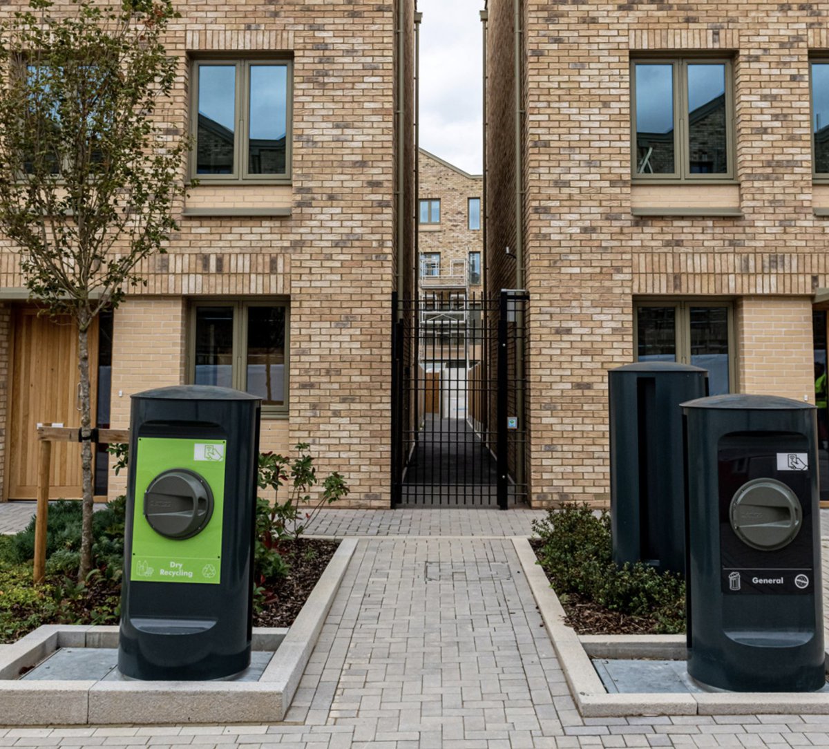The Envac system at Barking Riverside has cut on-street bins by 98% and waste collection-related carbon emissions by 90% by removing the need for on-site waste collection trucks, by transporting waste from ~2000 homes through an underground pipe network via airflow.