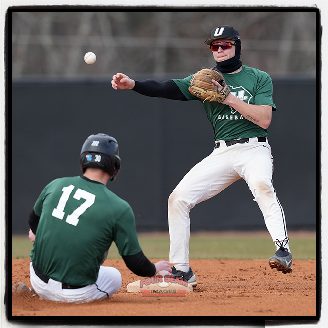 Johnny Sweeney (17) of the USC Upstate Spartans is out as second baseman Alex Ritzer (5) throws to first in a preseason intrasquad scrimmage on Friday, January 24, 2025, at Cleveland S. Harley Park in Spartanburg, South Carolina. (Tom Priddy/Four Seam Images)