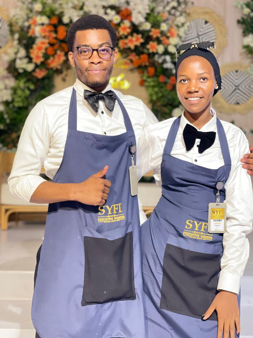 Buchi52267147's tweet image. Meet the #SYFI Executive Ushers—your go-to team for excellence and elegance at every event. Professional, personable, and always prepared to make your special moments unforgettable. Book with us today! #EventSolutions #SYFIUshers@ugandastatehouse