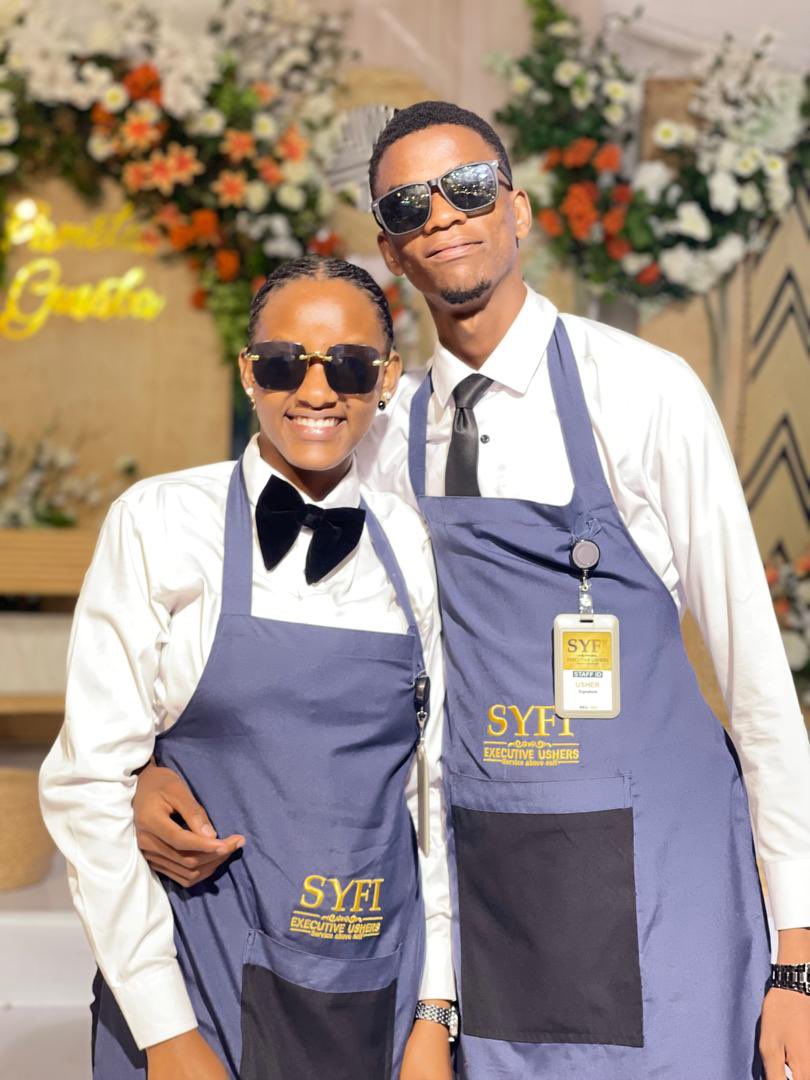 Buchi52267147's tweet image. Meet the #SYFI Executive Ushers—your go-to team for excellence and elegance at every event. Professional, personable, and always prepared to make your special moments unforgettable. Book with us today! #EventSolutions #SYFIUshers@ugandastatehouse