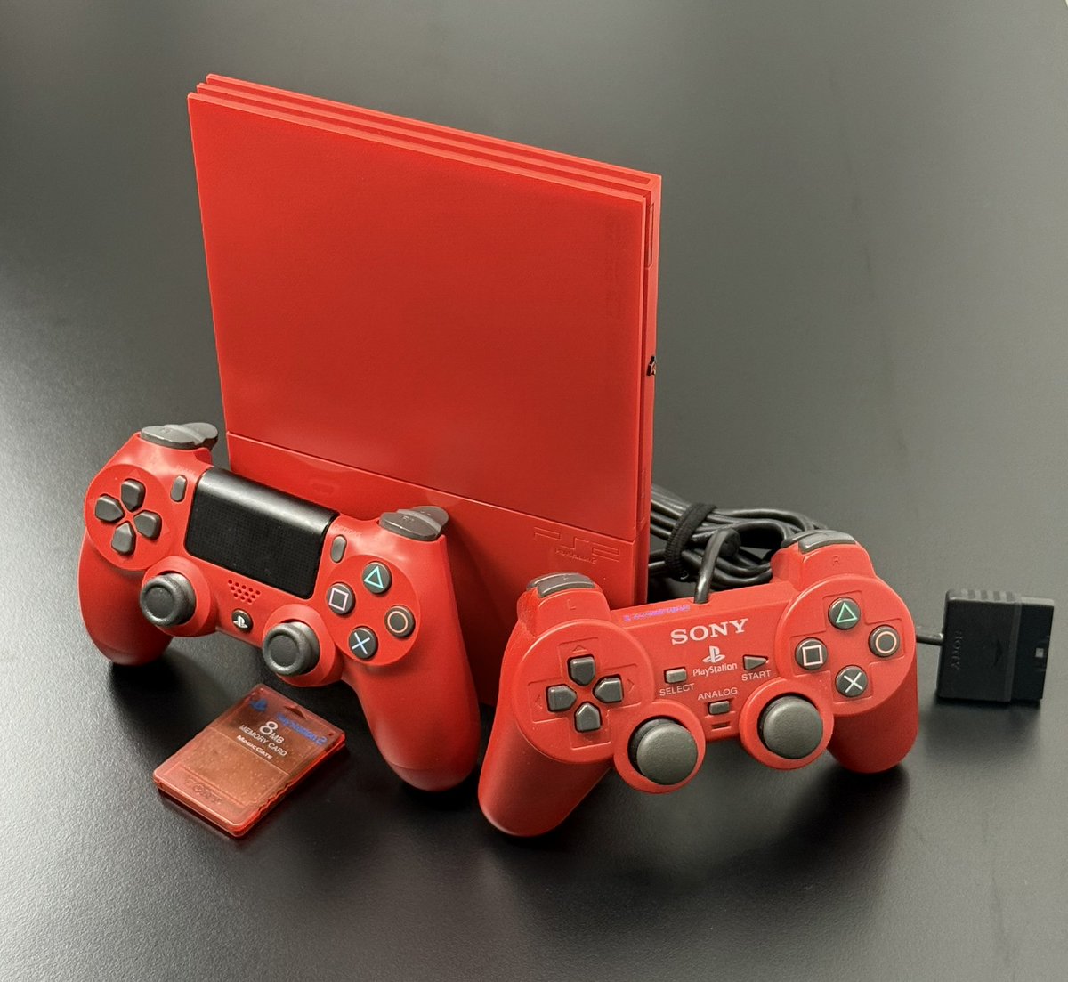 RetroCraftCo's tweet photo. We teased it. And here it is. Obvious inspiration from @Gusse__ and learnings from @modzvilleusa and @Voultar 

I tried to build the ultimate PS2. 

Genuine Sony PS2 Red ‘Cinnabar’
Fitted with a Modbo for region free disc loading and the @PixelFXco GEM Shiney.  Powered by USBC PD https://t.co/IkNt4Gzr4Z