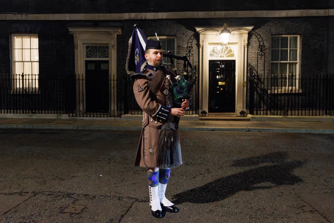 A piper plays bagpipes outside 10 Downing Street to celebrate Burns Night.