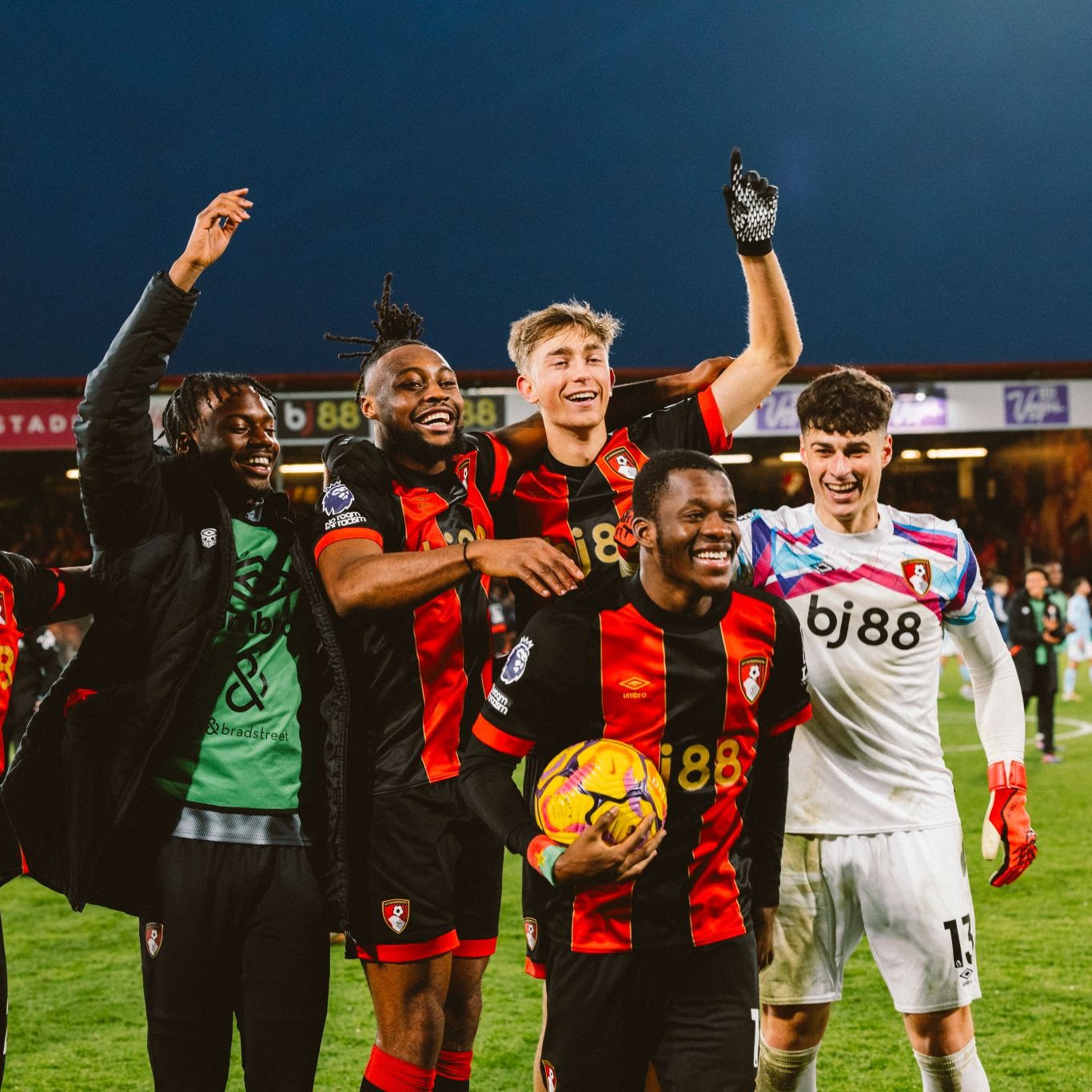 Dango Ouattara, Antoine Semenyo, Dean Huijsen and Kepa all celebrate on the pitch.