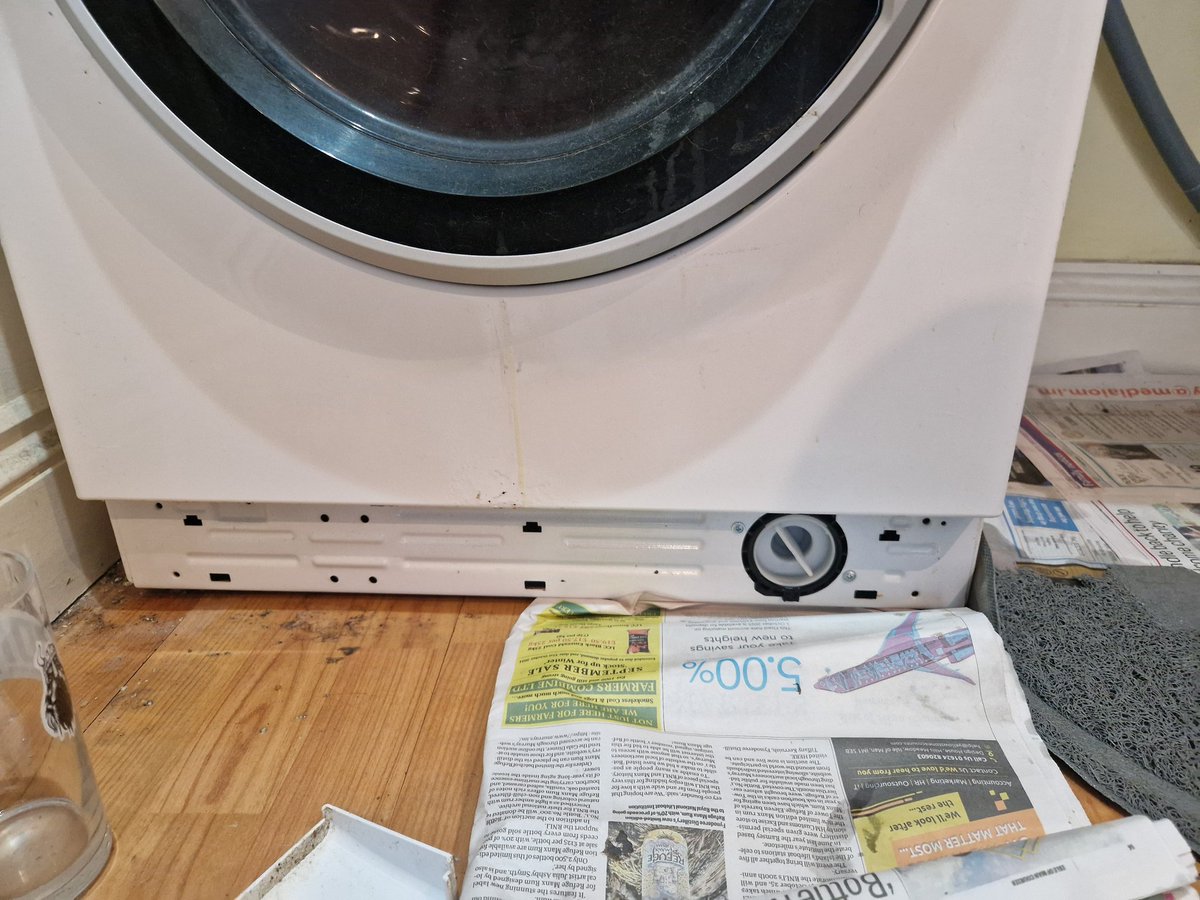aimdrummer's tweet photo. What gonk at @HotpointUK designed this machine so it is impossible to drain your machine through the filter plug without flooding your room? https://t.co/mL8YpTVKmu