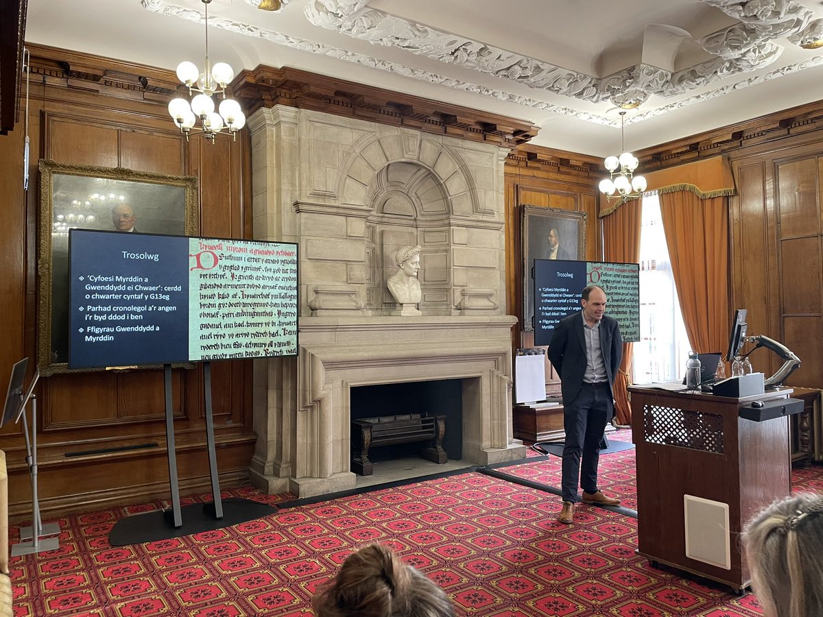 Barddoniaeth Myrddin (@prosiectmyrddin) on Twitter photo <a href="/DH_Swansea/">Digital Humanities @ Swansea University</a> <a href="/claire_lober/">Claire</a> <a href="/CymraegBangor/">Cymraeg Bangor</a> <a href="/Department_ASNC/">ASNC Cambridge</a> @DrVictoriaFlood <a href="/unibirmingham/">Uni of Birmingham</a> <a href="/LlHopwood/">Dr Llewelyn Hopwood (He/Him | Fe)</a> <a href="/ysgolygymraeg/">Ysgol y Gymraeg</a> <a href="/Ganolfan/">Y Ganolfan Geltaidd</a> Diwedd y dydd a “diwedd y byd” yng Nghyfoesi Myrddin a Gwenddydd ei chwaer.
Our Co-I David Callander (<a href="/ysgolygymraeg/">Ysgol y Gymraeg</a> ) opens the final session of the day with the theme of “the end of the world” in early Myrddin poetry. <a href="/DH_Swansea/">Digital Humanities @ Swansea University</a> <a href="/claire_lober/">Claire</a> <a href="/CymraegBangor/">Cymraeg Bangor</a> <a href="/Department_ASNC/">ASNC Cambridge</a> @DrVictoriaFlood <a href="/unibirmingham/">Uni of Birmingham</a> <a href="/LlHopwood/">Dr Llewelyn Hopwood (He/Him | Fe)</a> <a href="/ysgolygymraeg/">Ysgol y Gymraeg</a> <a href="/Ganolfan/">Y Ganolfan Geltaidd</a> Diwedd y dydd a “diwedd y byd” yng Nghyfoesi Myrddin a Gwenddydd ei chwaer.
Our Co-I David Callander (<a href="/ysgolygymraeg/">Ysgol y Gymraeg</a> ) opens the final session of the day with the theme of “the end of the world” in early Myrddin poetry.