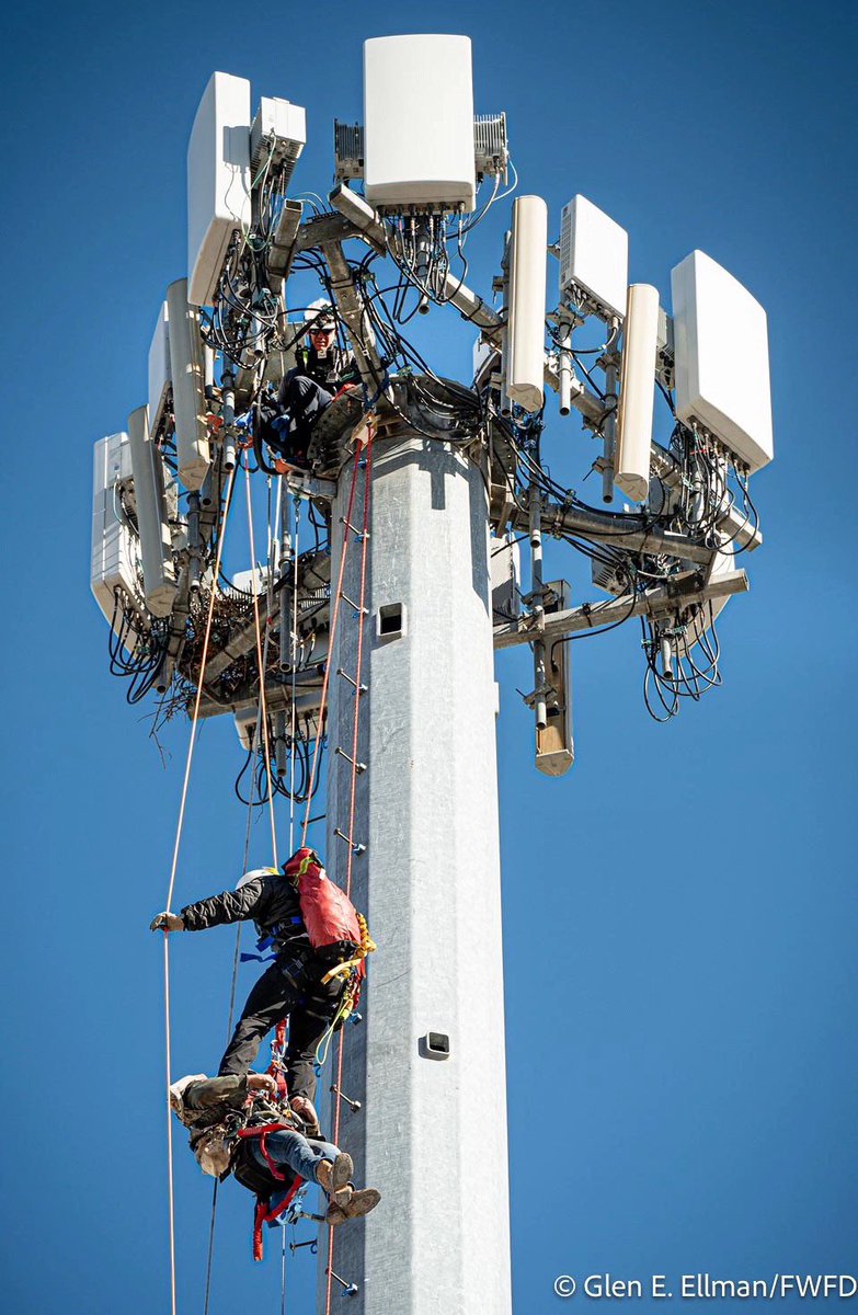FortWorthFire's tweet photo. Just after noon yesterday (Friday, January 24, 2025), the Fort Worth Fire Department Alarm Office received a request for assistance with a high angle rescue from our neighbors down south with the @CityofBurleson Fire Department. 

A contractor crew had somehow come in contact with electrical lines in the 700 block of North Burleson Boulevard inside of a substation— 150 feet high. We were told that the contractors had actually been working on the tower since about 9:00am that morning before the incident happened. 

We quickly dispatched our technical rescue team (TRT) to assist with the effort. They brought with them Battalions 1 and 2, Engine 1 and 2, Medic 1, Support 1, Squad 2, Tower 1 and Ops 2. 

When our crews arrived on scene, they met with Burleson FD and saw three contractors who were at the top of the tower. Two of the them were uninjured and ultimately able to get down by themselves. 

Unfortunately, one was critically injured and needed to be rescued. It was a worse-case scenario: He was injured and stranded 15 stories in the air— straight up the pole. 

The power was turned off to nearby residents so we could ensure there was no further risk to the patient or our first responders while executing this type of response. 

After a collaborative plan was created, a rescue team ascended up the pole. The team was compromised of one firefighter from Burleson FD and one from Fort Worth to build the systems that would be needed to safely lower the injured contractor back down. 

A lot of heavy equipment has to be taken all the way up with these rescuers. That way they can build everything they will need to safely bring themselves, the patient and the equipment back down when ready. 

These types of responses are physically demanding on the body and use different muscle groups than what most people are used to using. All of these factors were met with chilly temperatures and winds that kept the pole swaying back and forth 150 feet in the air… while meticulously trying to do what needed to be done. 

Our teams are highly skilled in technical rescues just like this one. Calls like this don’t happen that often so these teams dedicate much of their time to training. This ensures that when we do get these calls, they have the best shot of having a positive outcome. 

The mindset of these responses are completely different from that of fighting fires. With one— we rush in and put out the fire as fast as we can, run in and search for people inside as fast as we can and do what’s needed to protect people��s property as fast as we can. With the other— we’re slow, calculated, methodical, mapped out and precise. 

They are called “technical rescue” for a reason. Rope systems, anchor systems and pulley systems have to be built on site and then put in place right there during the response. With rescue groups high up top, crews working on top of the truck and ground teams below that help with the hoisting— they seamlessly work together hand in hand. YET, they are physically spread out over the entire scene. This requires clear, loud and concise radio communications between everyone involved so that everyone is moving at the exact same time. Otherwise, it won’t work. It’s an extremely complex effort that takes A LOT of time all the while knowing time is of the essence to rescue the injured victim. 

Several hours after arriving, the teams were successful in bringing down the patient. He was given emergency life saving care and loaded into the back of an ambulance before being transported to a local burn facility. 

Well deserved hugs and high fives were given out by the firefighters that were happy that all of our training paid off and brought the best possible outcome for this patient and his loved ones. And… everyone went home safely. 

Stay safe, #FortWorth (and you too Burleson).