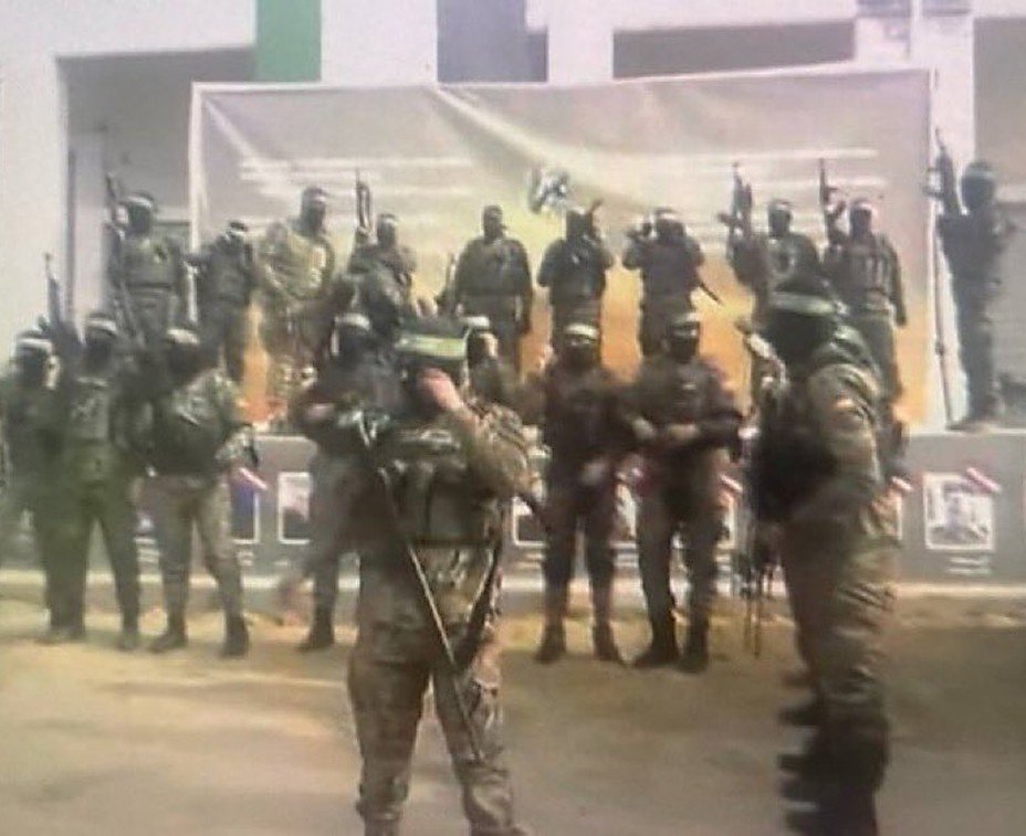 shlomitlir's tweet photo. As the philosopher Hannah Arendt noted, totalitarian regimes use ceremonies as tools of control, oppression, and the subjugation of the masses. These regimes assert their absolute dominance through grandiose displays of power designed to suppress their citizens, instill fear, and foster blind loyalty.

The cynical signing ceremony staged by Hamas militants with representatives of the Red Cross and the hostages, conducted on a stage adorned with symbols and slogans, exemplifies the twisted and destructive ideology that fuels the mass psychosis in Gaza.

Such displays of terror and tyranny serve as a stark warning of what happens to a society that succumbs entirely to authority and power.