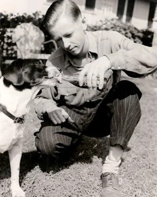 So this is Charles… but that’s not his dog. Snoopy was based off of Charles Schulz’s family dog, Spike. He also had a dog later named Andy that he adored. Here’s Charles Schulz and Spike.