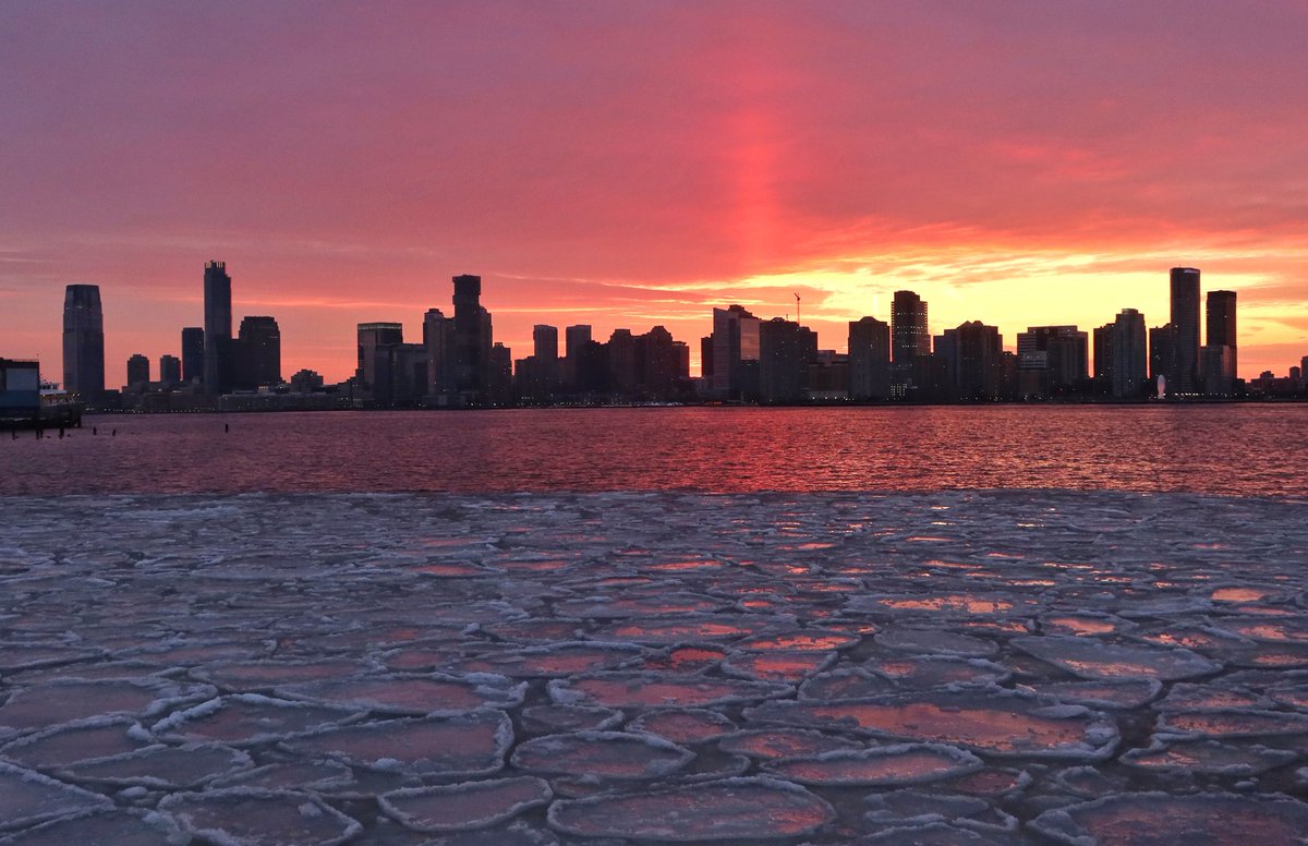 GaryHershorn's tweet photo. Ice floating in the Hudson River in New York City as the sun sets behind the skyline of Jersey City, NJ, Saturday evening #newyorkcity #nyc #newyork #sunset #icefloe https://t.co/71YiBgGn1x