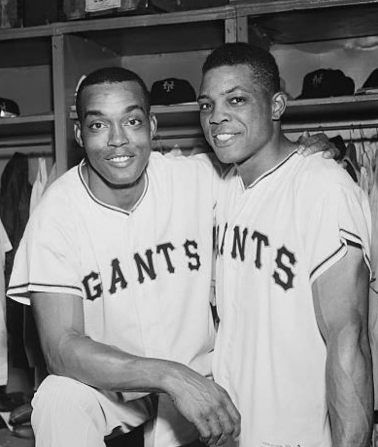 Monte Irvin and Willie Mays in the locker room after a game, June 22, 1954. Irvin was asked to mentor Mays when he joined the Giants, helping him adjust to life in New York and professional baseball. Irvin was Mays' only road roommate in National League baseball, with a possible
