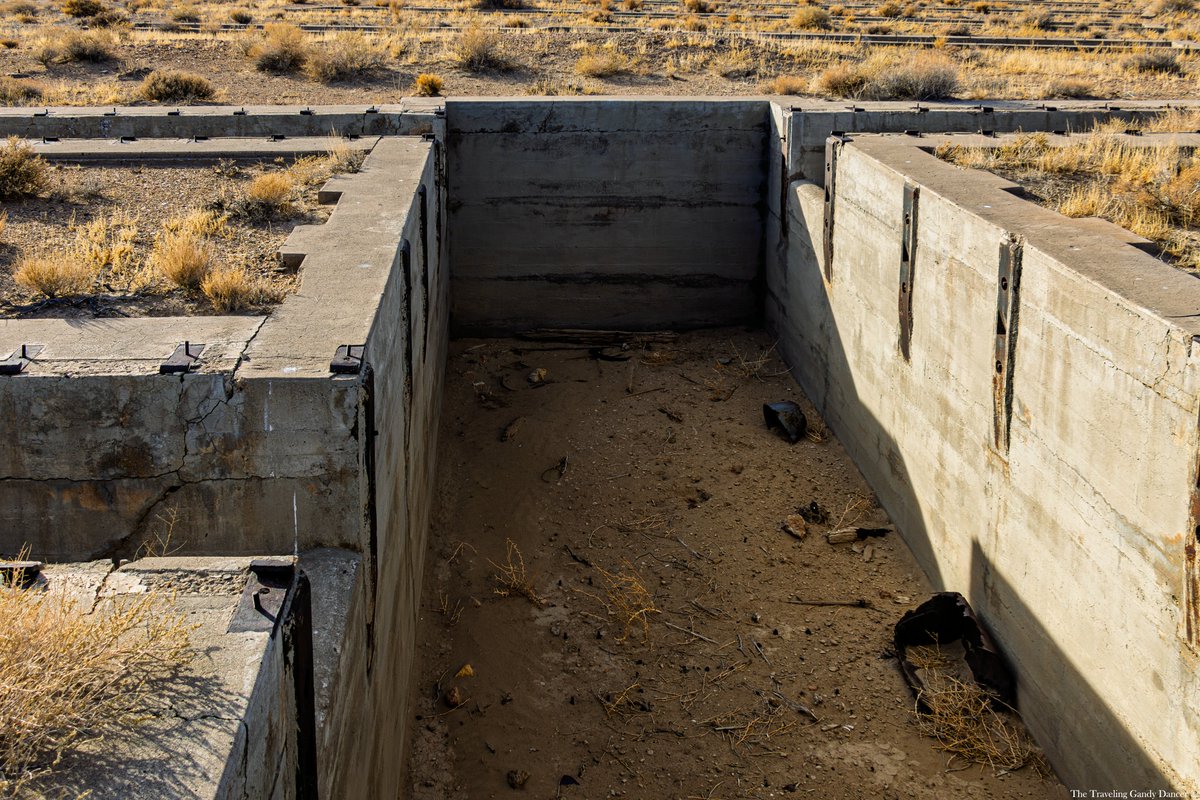 TTGandyDancer's tweet photo. The Tonopah and Goldfield Railroad (T&GRR) once maintained its rail yard and roundhouse in Millers NV, located about 10 miles outside of Tonopah. The relatively flat terrain in Millers provided an ideal setting for such operations, making it a strategic choice for the railroad. The proximity to an ore processing facility further enhanced the practicality of this location. Operating from 1905 to 1947, the T&GRR played a significant role in the region’s industrial history, and remnants of this once-vital railroad can still be found today.

Remarkably, the pit for the 90-foot-diameter turntable remains in excellent condition considering its age. Alongside it are the remains of pits and service tracks that once supported the railroad’s eight-stall roundhouse. Visitors can also spot traces of old roadbeds, wooden ties, bolts, spikes, and other artifacts scattered throughout the site. These fragments offer a window into the bustling activity of Millers during the railroad's prime, preserving a piece of the area's rich industrial heritage.

For those wishing to visit, the site is easily accessible from U.S. Route 95 via a turnoff near the Millers Rest Area. From there, a short traverse along a dirt road followed by a walk will bring you to the historic location. The drive and walk are manageable for most vehicles and visitors, requiring no special skills. - Google Maps Link - https://t.co/op8s3KtMfG

#railfanning #steamengine #trainphotography #railroadphotography #railfans_of_instagram #trainyard #railroadhistory #railheritage #nevadahistory #tonopah #ttgandydancer