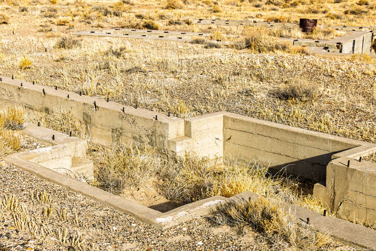 TTGandyDancer's tweet photo. The Tonopah and Goldfield Railroad (T&GRR) once maintained its rail yard and roundhouse in Millers NV, located about 10 miles outside of Tonopah. The relatively flat terrain in Millers provided an ideal setting for such operations, making it a strategic choice for the railroad. The proximity to an ore processing facility further enhanced the practicality of this location. Operating from 1905 to 1947, the T&GRR played a significant role in the region’s industrial history, and remnants of this once-vital railroad can still be found today.

Remarkably, the pit for the 90-foot-diameter turntable remains in excellent condition considering its age. Alongside it are the remains of pits and service tracks that once supported the railroad’s eight-stall roundhouse. Visitors can also spot traces of old roadbeds, wooden ties, bolts, spikes, and other artifacts scattered throughout the site. These fragments offer a window into the bustling activity of Millers during the railroad's prime, preserving a piece of the area's rich industrial heritage.

For those wishing to visit, the site is easily accessible from U.S. Route 95 via a turnoff near the Millers Rest Area. From there, a short traverse along a dirt road followed by a walk will bring you to the historic location. The drive and walk are manageable for most vehicles and visitors, requiring no special skills. - Google Maps Link - https://t.co/op8s3KtMfG

#railfanning #steamengine #trainphotography #railroadphotography #railfans_of_instagram #trainyard #railroadhistory #railheritage #nevadahistory #tonopah #ttgandydancer