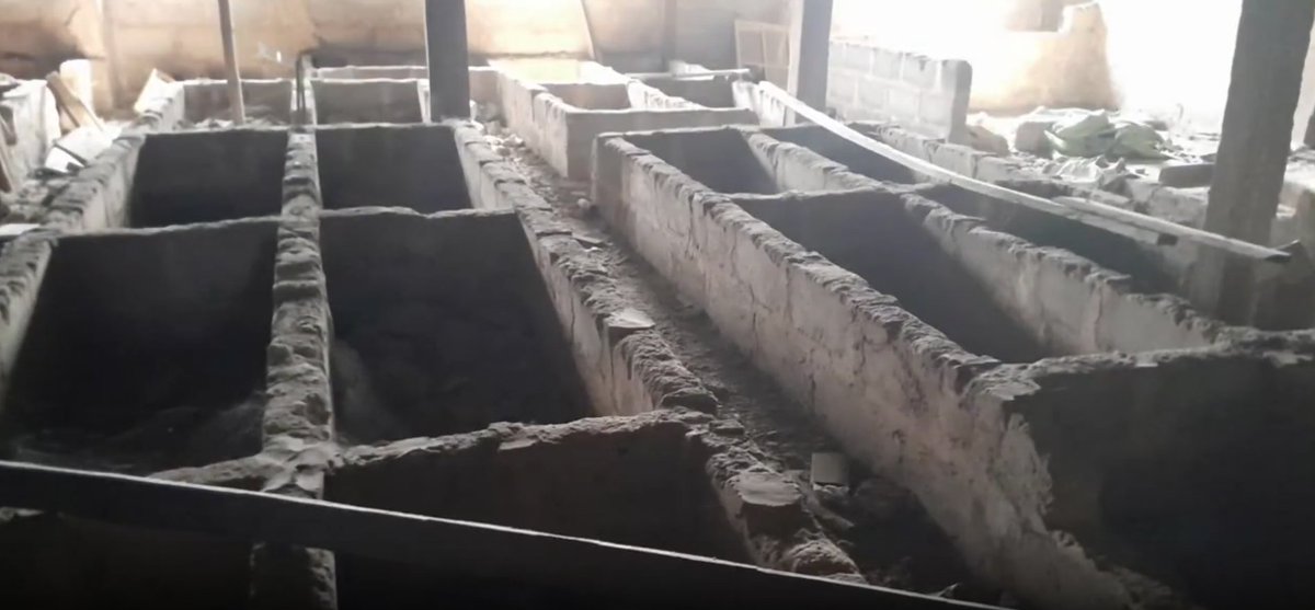 Naija_PR's tweet image. Anambra State Government demolishes a kidnappers' den disguised as a hotel with a shrine and over 30 partitioned graves on its top floor