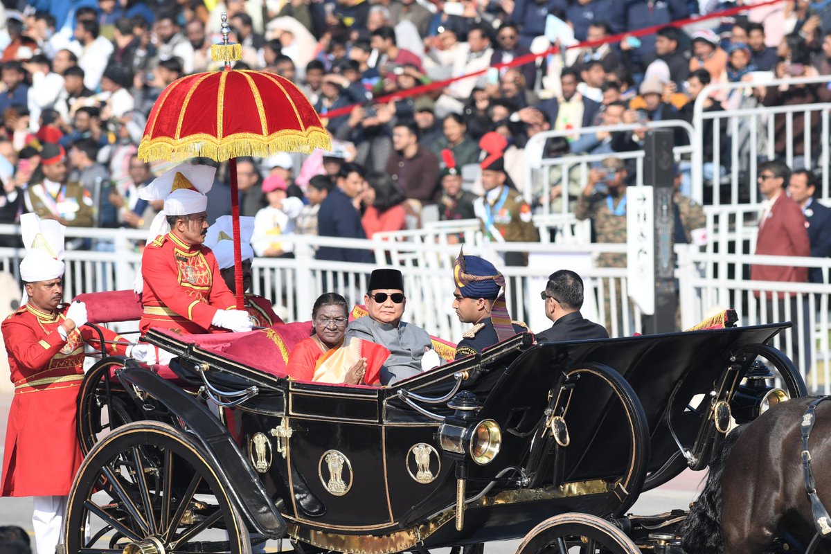 rashtrapatibhvn's tweet photo. President Droupadi Murmu and the Chief Guest of 76th Republic Day, President Prabowo Subianto of Indonesia, witnessed the Republic Day parade which showcased Bharat's socio-economic, technological and military prowess as well as the richness and diversity of its culture. Following the beautiful tableaux highlighting India's civilizational heritage and reflecting citizens' aspirations, a spectacular performance of traditional folk and tribal artists and impressive flypast enthralled the invitees and viewers.