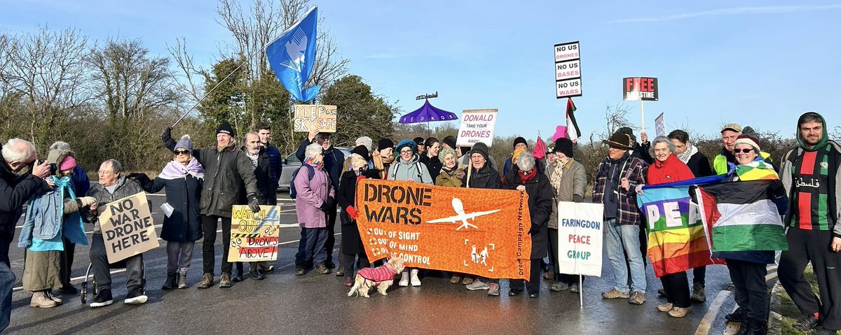 CNDuk's tweet photo. Fantastic protest at RAF Fairford - home to US spy drones used in Gaza. Instead of hiding behind bogus arguments of national security, the British government should be held accountable for war crimes perpetrated from its bases. #KickOutUSDrones https://t.co/QsnU070znP