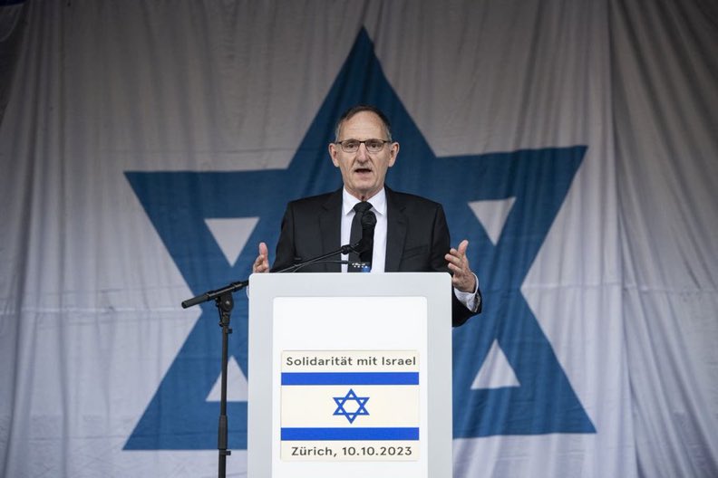 Lowkey0nline's tweet photo. This picture has emerged of Mario Fehr, Justice Director behind the arrest of Ali AbuNimah in Zurich, speaking at a solidarity with Israel event. https://t.co/CQVYj8CpXV