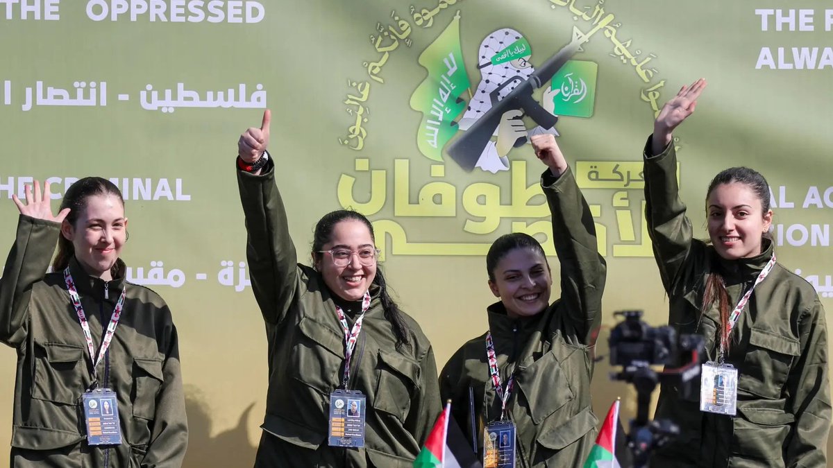 afalkhatib's tweet photo. In a desperate attempt to create the illusion of “victory,” Hamas’s criminals thought it’d be a glorious idea to parade four young Israeli female hostages on stage before releasing them. The young women were forced to make statements about how well they were treated, how good the terrorists were to them, and how incredibly grateful they were for the protection of Hamas. The group thought it could cover up the shame associated with holding women hostages for 15 months, in total violation of cultural, religious, and humanistic norms. By dressing them up in uniforms resembling the IDF’s colors, Hamas thought it would erase the cowardice of how these women were captured in their pajamas and were paraded around by savage thugs who bragged about them being “sabaya” or sex slaves.
Hamas thought it could somehow make Gazans forget the disaster it had brought upon them by carrying out a military parade to release young women who have had to endure vulnerability, damp tunnels, and an uncertain future. Hamas hoped that by constructing a stage, using aid fuel for a terror parade instead of fueling hospital generators, ambulances, and fire and rescue trucks, it could excite the hordes of “pro-Palestine” Twitter/demonstration Mujahideen in Jordan, Pakistan, the United Kingdom, the US, Turkey, France, and all over the world, who have normalized violent Islamist extremism as a legitimate form of “resistance.”
Instead, what Hamas did was display four young women who were not afraid and did not cower before hundreds of armed terrorists who had hoped these women would appear weak, pathetic, and feeble. Instead, Hamas gave these women a chance to make up for the horror they experienced during their initial captivity, in which they were bloodied, confused, dazed, and terrified. In a bizarre twist of fate, Hamas inadvertently allowed these women to courageously close this horrendous chapter of their lives, standing tall, confident, and unfazed by the hostile atmosphere that Hamas had hoped would instill fear and terror in these young women to show the power of the “resistance.”
Additionally, and crucially, a large number of Gazans, unlike the Hamasniks abroad, are not buying the propaganda. They’re not looking at the aforementioned spectacle and thinking it was worth it or that Hamas achieved anything other than perpetual death and destruction. Yes, some are radicalized and full of hatred, not to mention those who are furious over what Israel has done to their lives for 15 months. But they still hold Hamas equally responsible for the reckless endangerment of their lives and futures, only to be “rewarded” with empty parades and hollow displays of victory.
Shame on anyone who witnessed the exchange yesterday and thought wow, this was worth annihilating Gaza over.