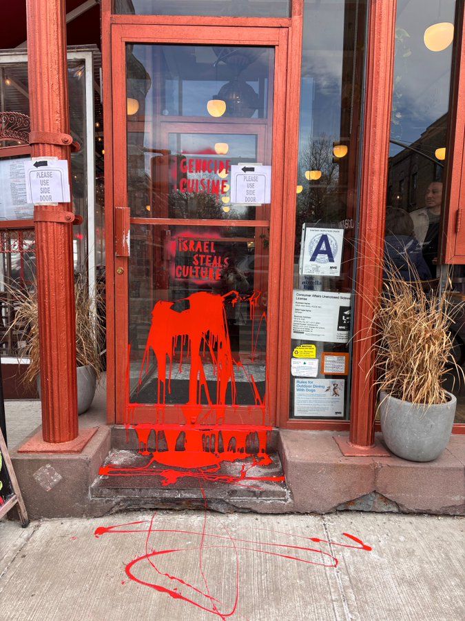 HenMazzig's tweet photo. Miriam, a popular Israeli restaurant in Brooklyn, was vandalized this morning with “Israel steals culture” and “genocide cuisine.”

Not only is this vandalism a disgusting act of anti-Jewish hatred, but the insinuation that Israelis don’t have cuisine and culture is dehumanizing.

Israeli food isn’t “stolen”—it’s the heritage of 850,000 Jewish refugees who were violently expelled from the Middle East.

On the eve of Holocaust Memorial Day, this bigotry—accusing Jews of genocide and cultural theft—is especially disturbing.