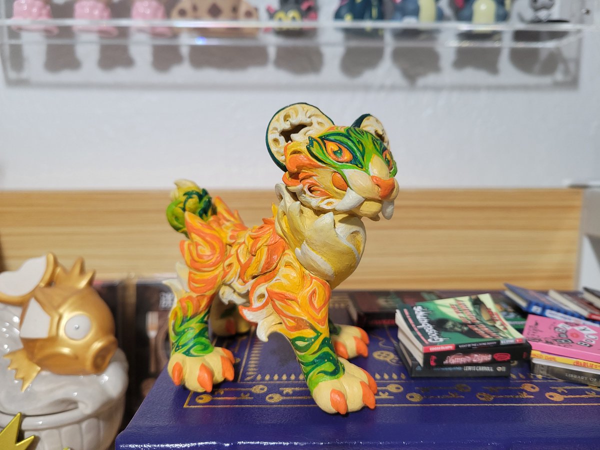 Meet my new shelf buddy! I made her out of aluminum foil and polymer clay! 🐅 🥭