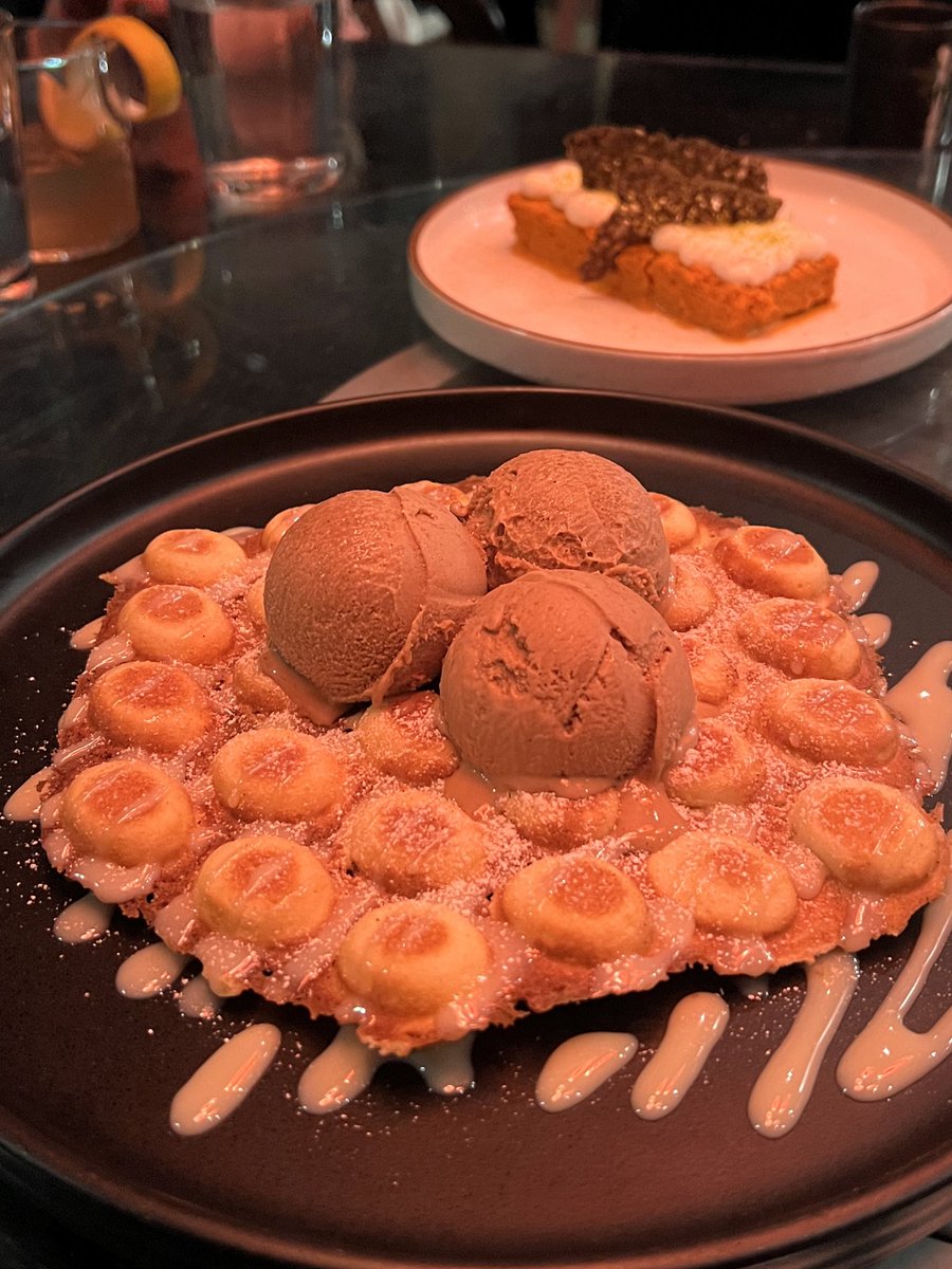 vietnamese iced coffee ice cream on top of hk bubble waffle + condensed milk drizzle / thai tea cake w dark chocolate brittle