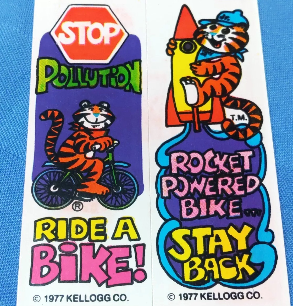 Kellogg's Tony the Tiger Frosted Flakes cereal cartoon mascot

Handstand temporary tattoo
Tigre Tono plastic box top tabs
1971 stickers "Stop Pollution Ride a Bike!" and "Rocket Powered Bike...Stay Back"