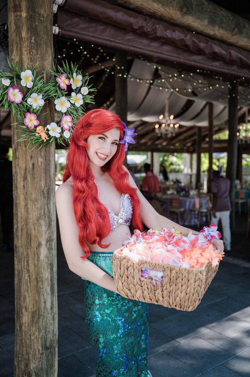DisneyWedCast's tweet photo. Jasmine's brother surprised her with a wedding-day visit from Ariel, who took photos with them after the ceremony and welcomed guests to the reception. Learn more about Paradise Cove weddings in Chapter 9 of the Fairytale Weddings Guide! https://t.co/PWnJ7z77dq https://t.co/KlNy4O3apk