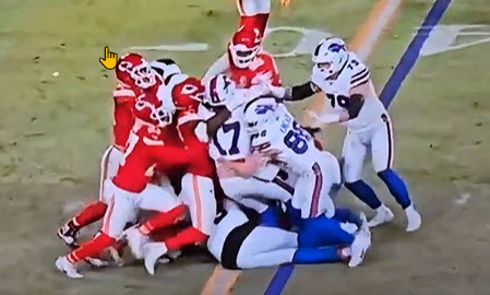 texanperry's tweet photo. Josh Allen is holding the ball with two hands in the middle of his body. He's clearly over the line. #Rigged https://t.co/M2eVdyiP6Y