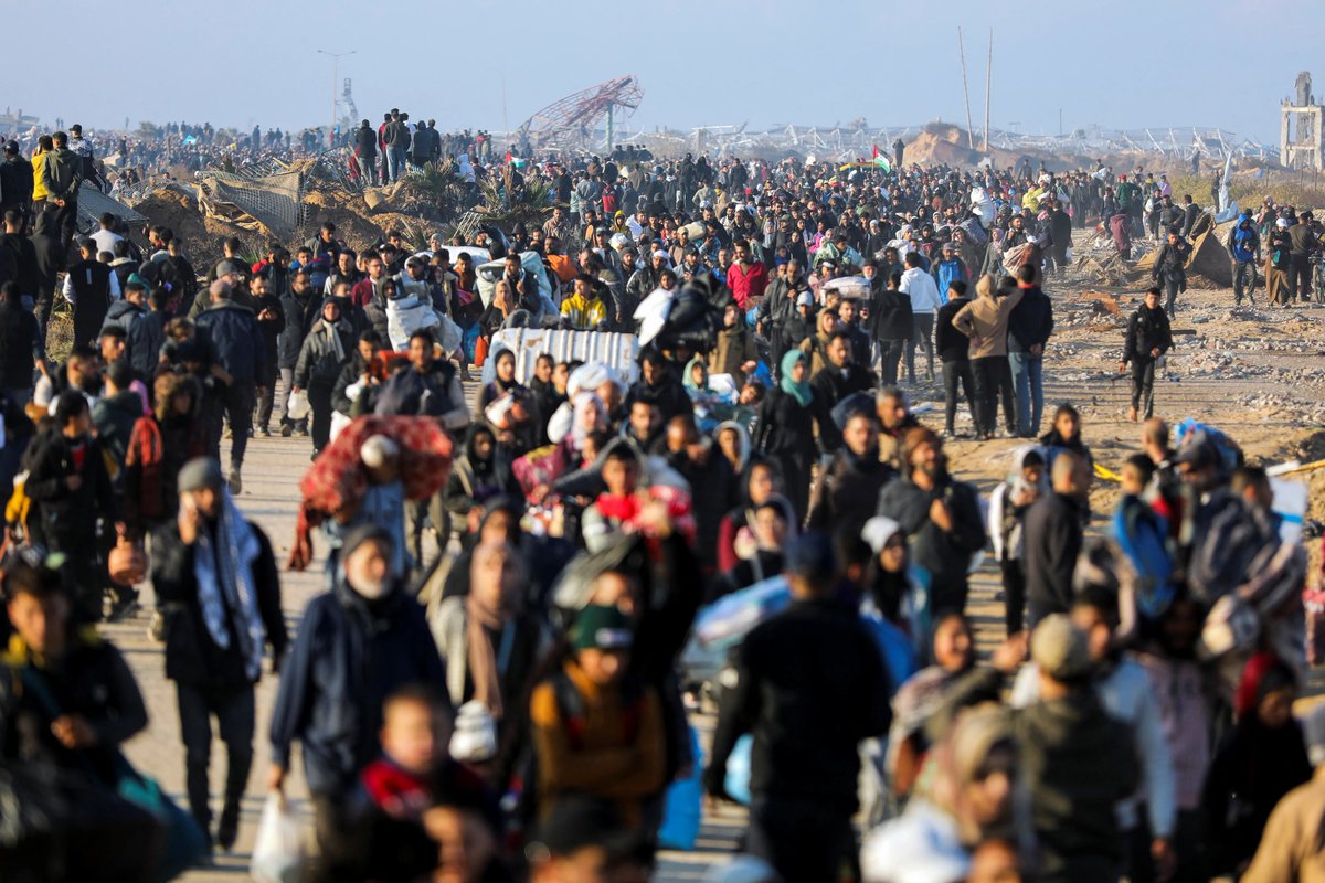 AJEnglish's tweet photo. Hundreds of thousands of Palestinians are returning to the heavily destroyed north of the Gaza Strip for the first time since the early weeks of the 15-month Israeli genocide in Gaza.

— in pictures https://t.co/Yb6XYPWpt3 https://t.co/UTK3RqoeXQ