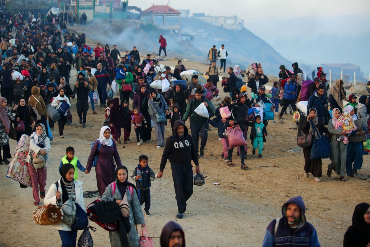 AJEnglish's tweet photo. Hundreds of thousands of Palestinians are returning to the heavily destroyed north of the Gaza Strip for the first time since the early weeks of the 15-month Israeli genocide in Gaza.

— in pictures https://t.co/Yb6XYPWpt3 https://t.co/UTK3RqoeXQ
