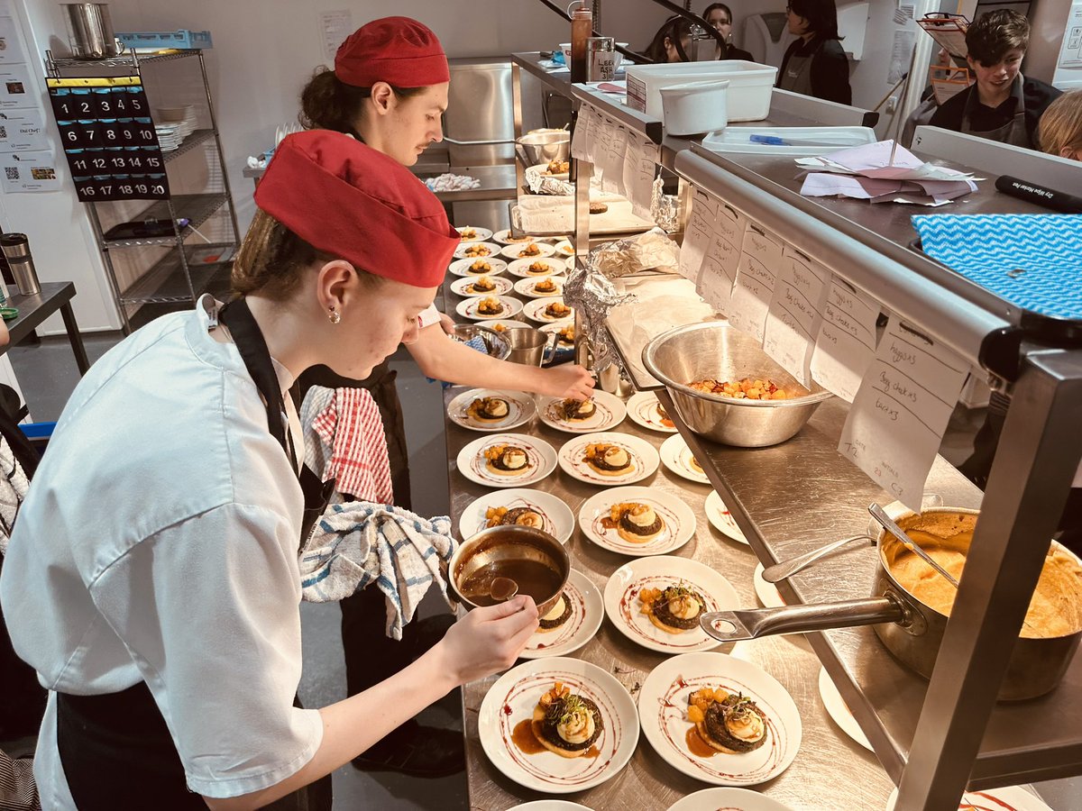 MMalacrino's tweet photo. @RestaurantAtT1 students putting on an amazing delight of food last week for #BurnsNight2025 to plate up for 45 guests! Being taught to do the skills for the job needed ! They delivered 💯! @abouttameside proud to tell the story ! https://t.co/xC55fpLvkY