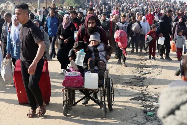 samebid's tweet photo. An image of collective endurance and hope. What burdens do they carry on their shoulders? What dreams light up their weary hearts? And how, amidst such pain, do they find joy? Questions we may never answer, for their strength lies in a realm beyond our understanding. https://t.co/pLDXNvXkxe