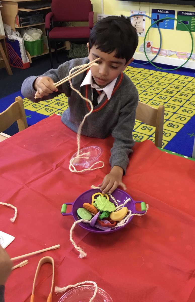 The children in #SJCR6 have been learning about the Lunar New Year. They have been using chopsticks to fill up bowls with ‘noodles’. #SJCInfants